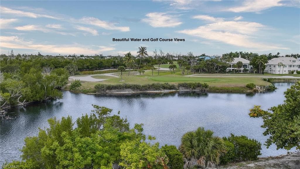 Water view with a golf course