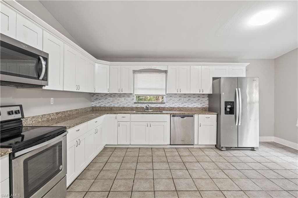 A chef-friendly kitchen with generous counter space and seamless flow to the family area.