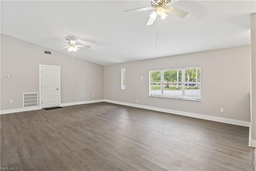 Comfortable family area with views of lush greenery just outside.