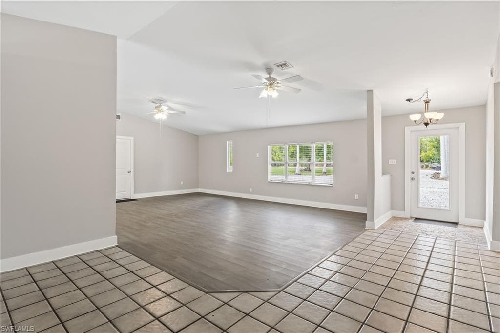 Spacious family and dining area designed for gatherings, offering an open-concept layout with beautiful views of the surrounding greenery.
