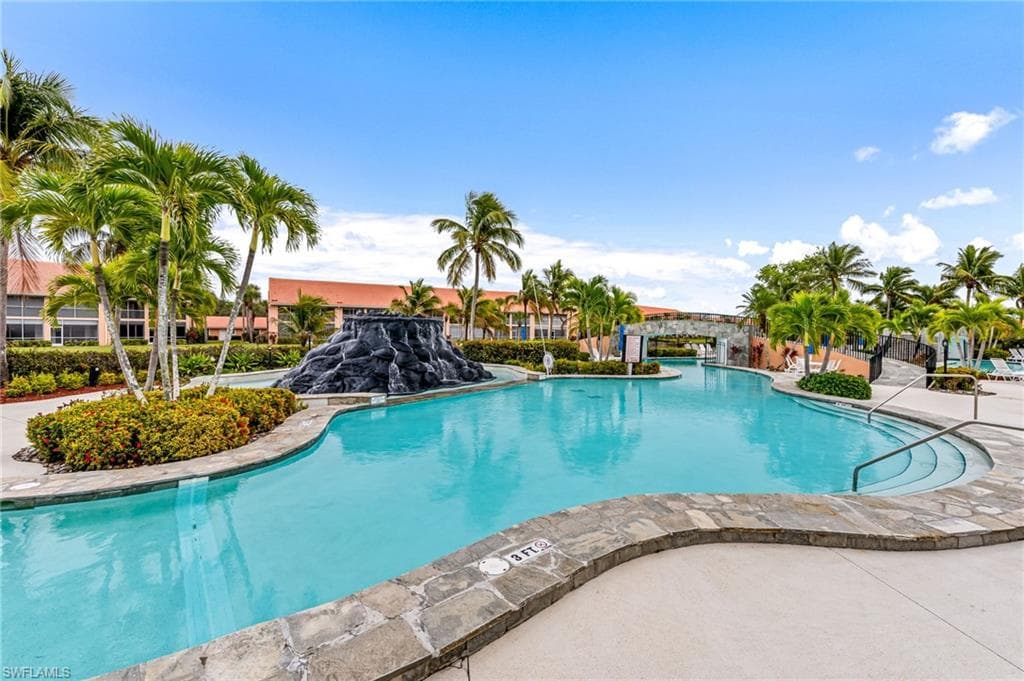 Community pool featuring a patio