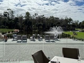 View of patio / terrace with a water view