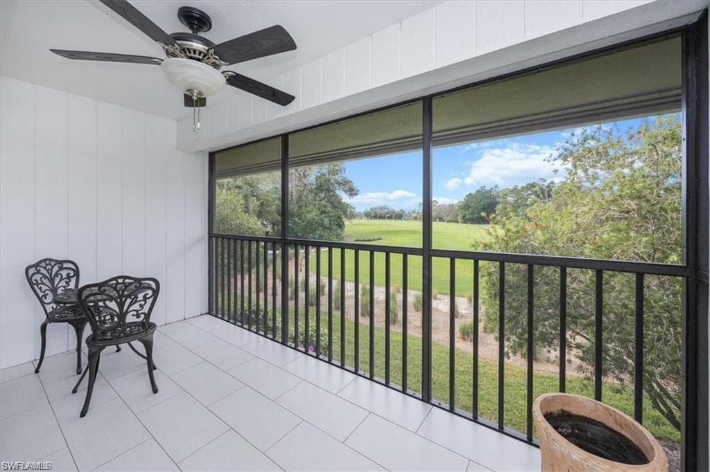 Sunroom featuring golf course view