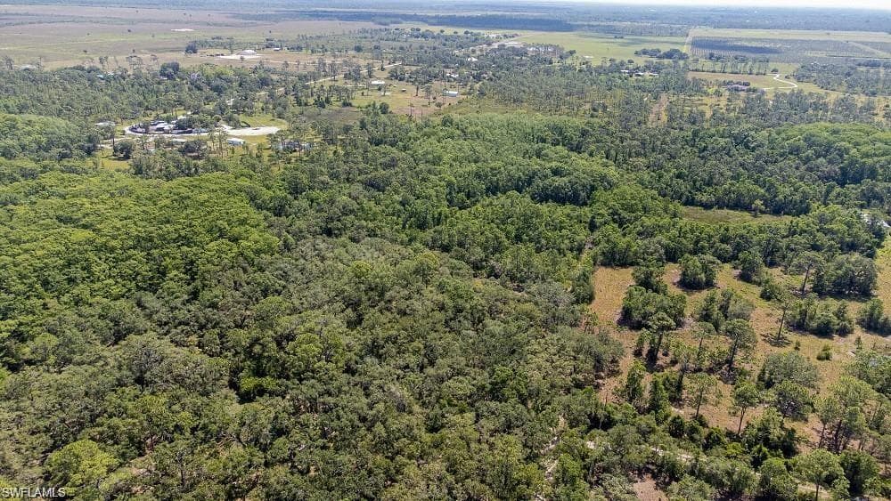 Aerial overview of property's location with a forest