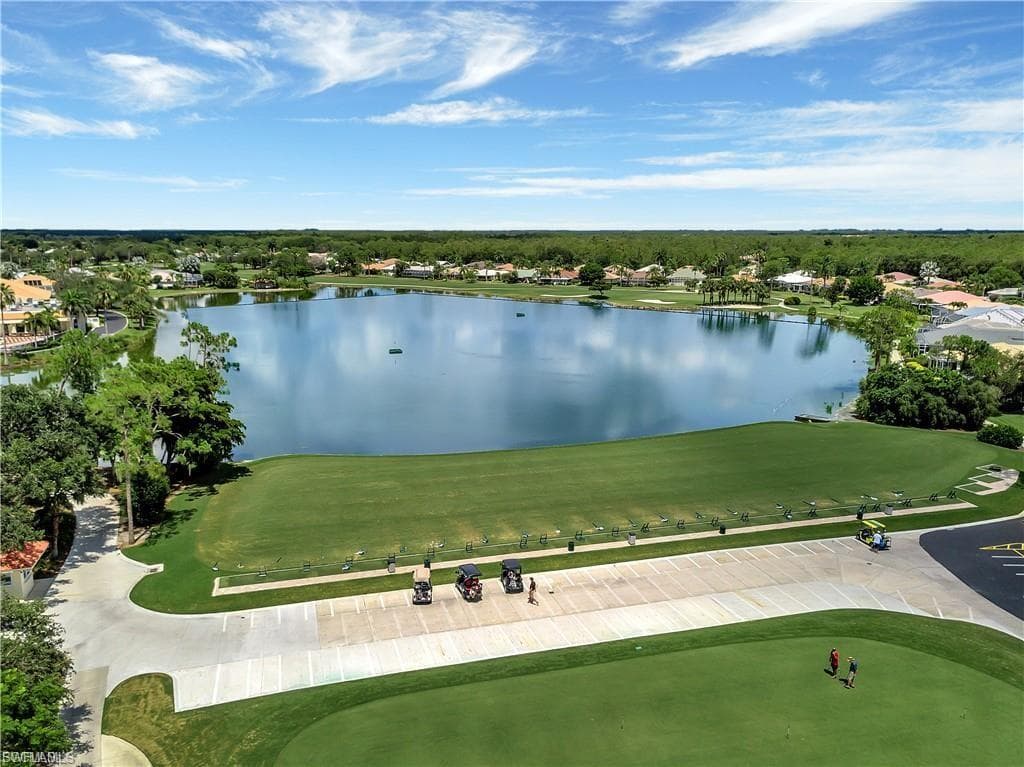 Aerial perspective of suburban area with a large body of water