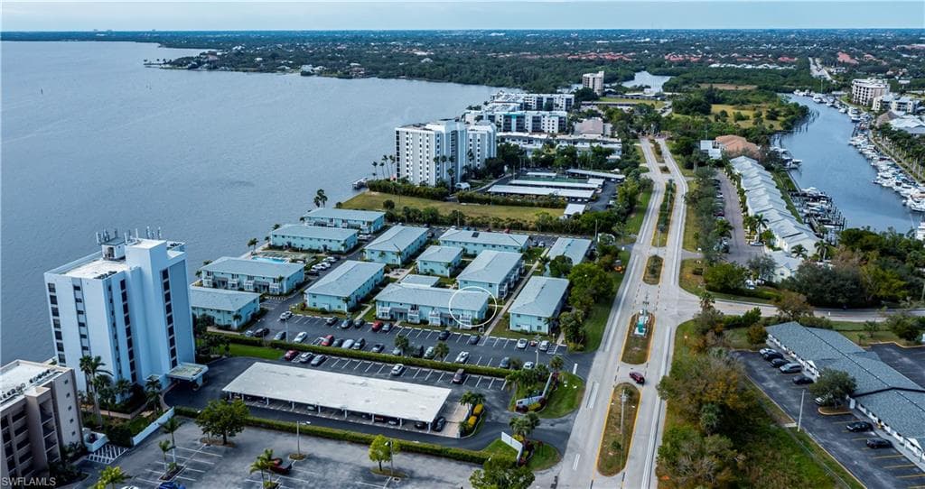 Birds eye view of property featuring a water view
