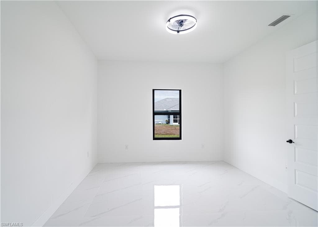 Empty room with light marble finish flooring