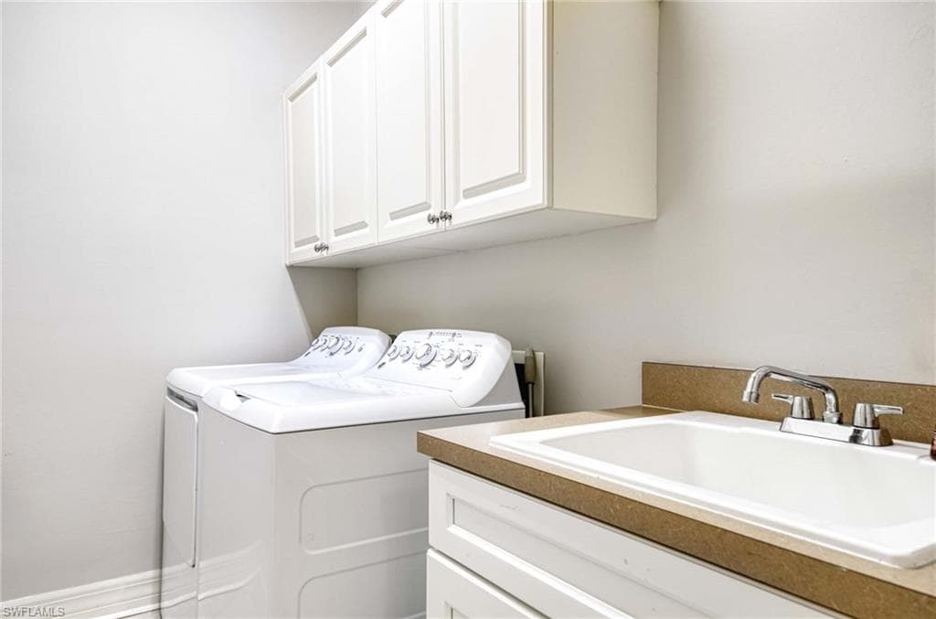 Washroom with independent washer and dryer and cabinet space