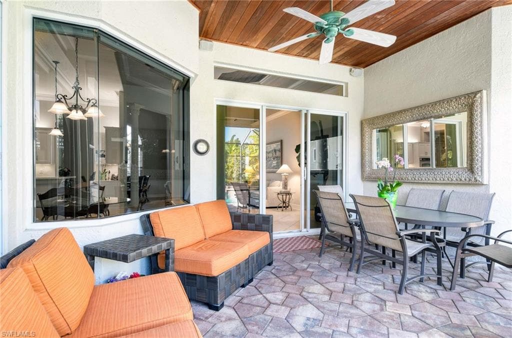 View of patio / terrace with outdoor dining area and ceiling fan