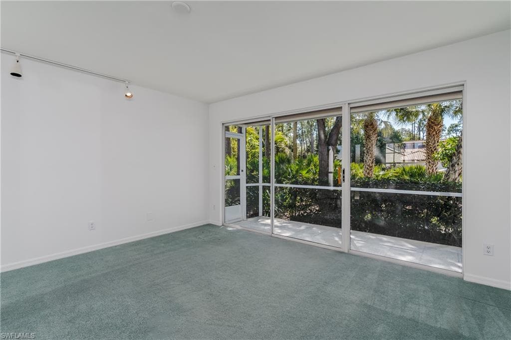 Spare room with carpet flooring and healthy amount of natural light