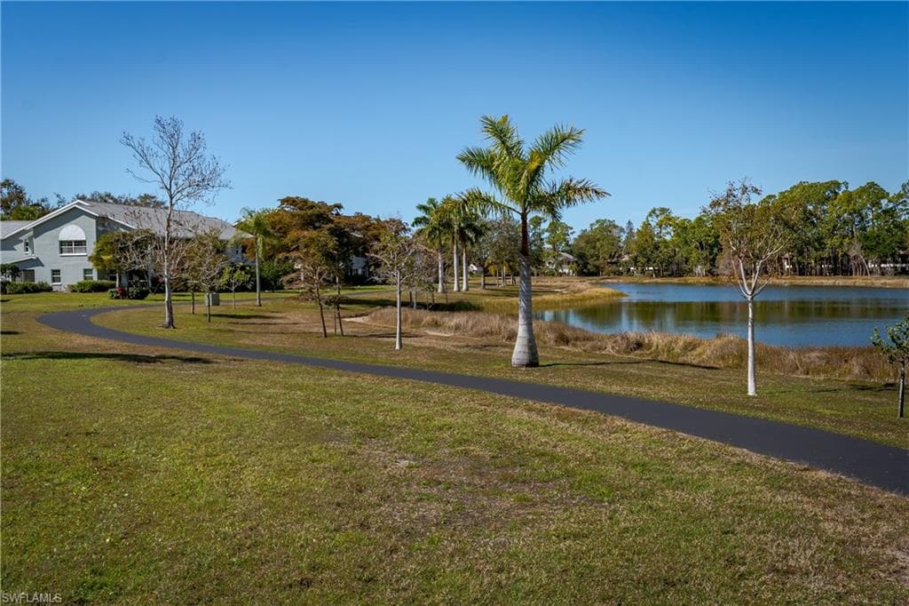 View of home's community with a water view