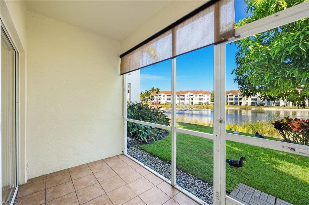 Screened-in sunroom with a view of the lake