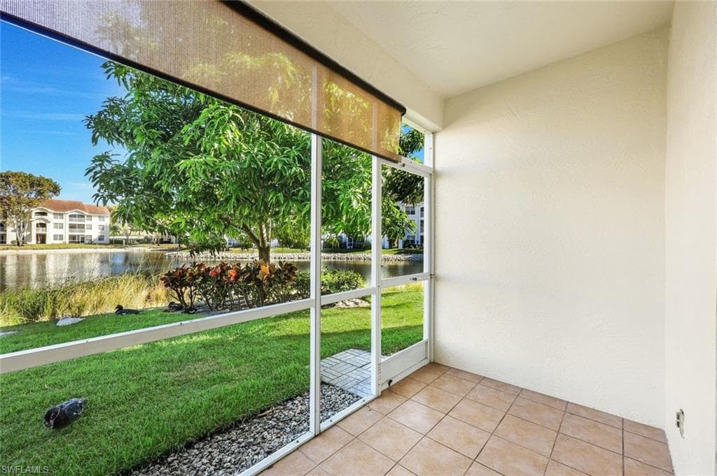 Screened-in sunroom with a view of the lake