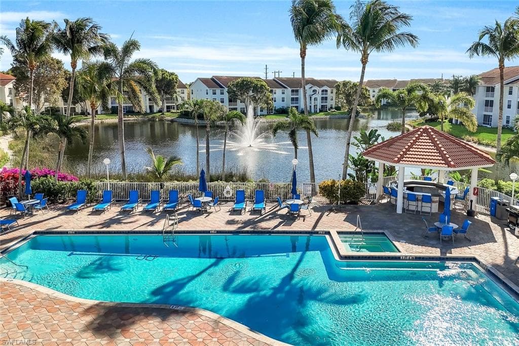 Community pool and hot tub with a party gazebo.