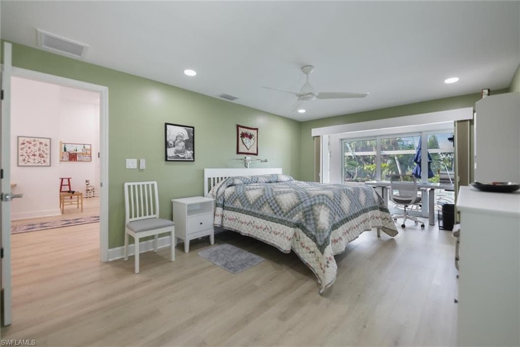 Bedroom featuring light wood-style flooring, recessed lighting, and ceiling fan