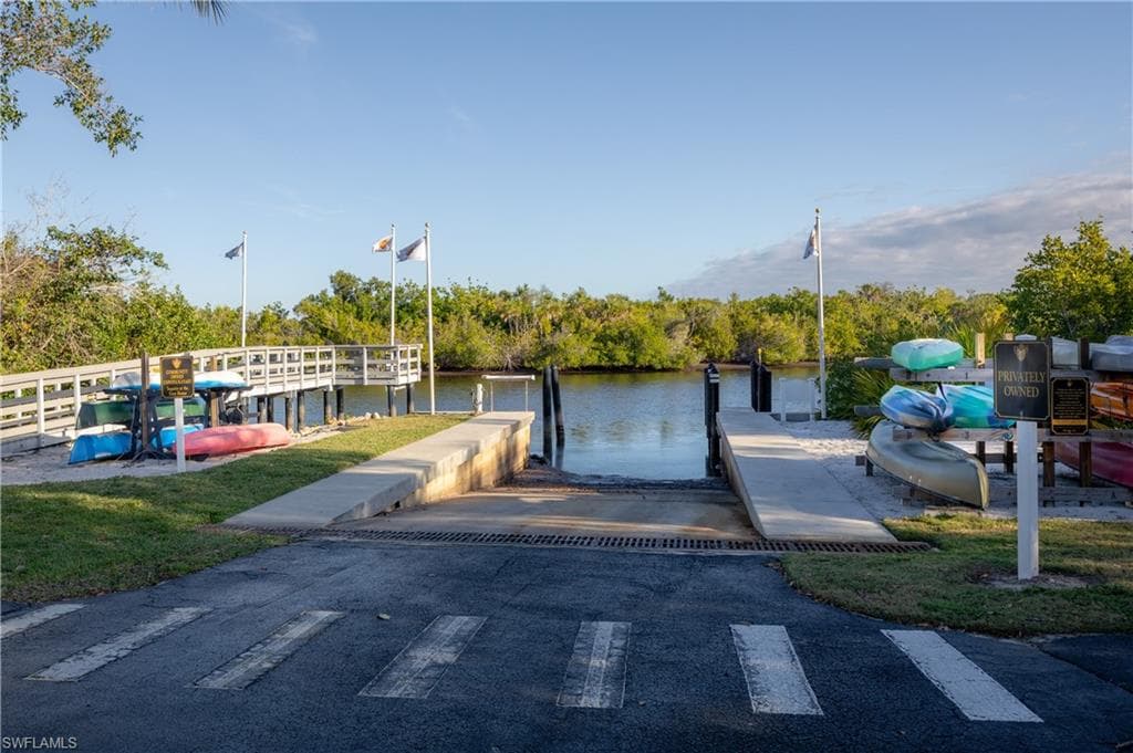 Dock featuring a boat ramp and a water view