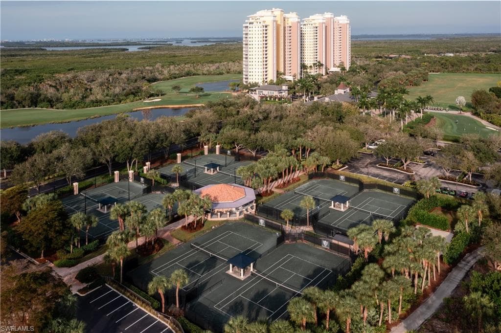 Drone / aerial view of a local golf course and a large body of water