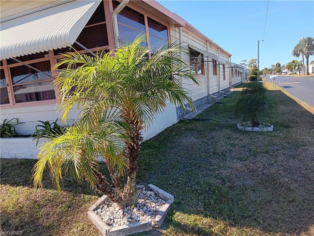 View of home's exterior with a lawn