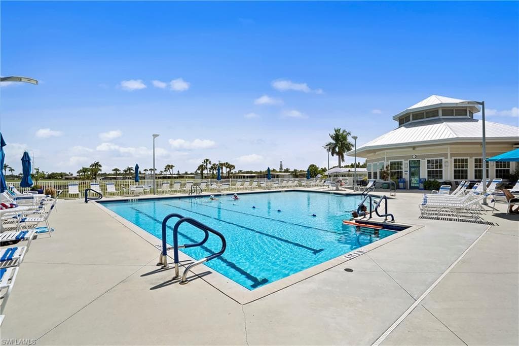 Community pool featuring a patio
