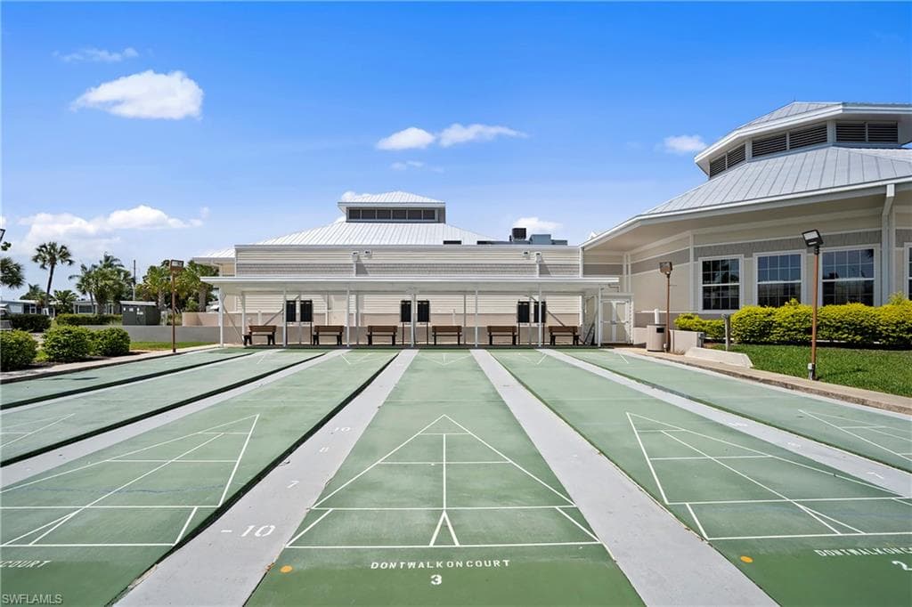 View of property's community with shuffleboard