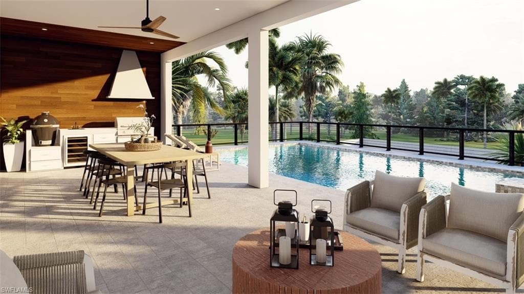 Virtual Rendering - View of swimming pool featuring an outdoor kitchen, a patio, and outdoor dining space