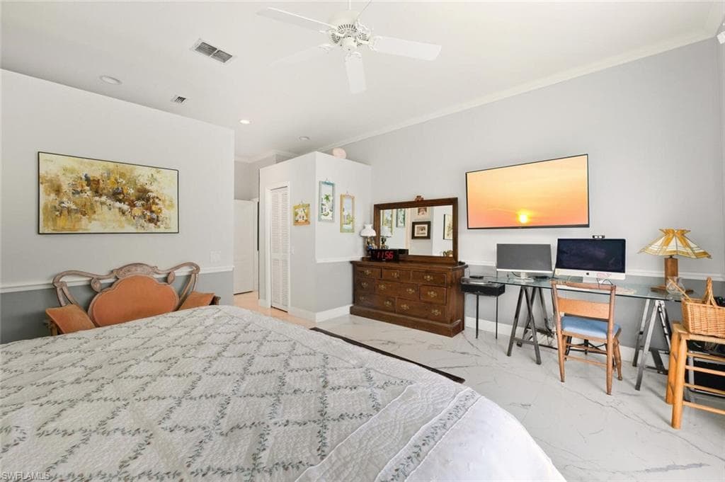Bedroom with light marble finish flooring, ornamental molding, a desk, a ceiling fan, and recessed lighting