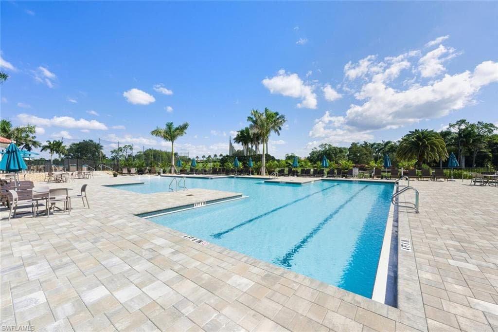 Community pool with a patio area