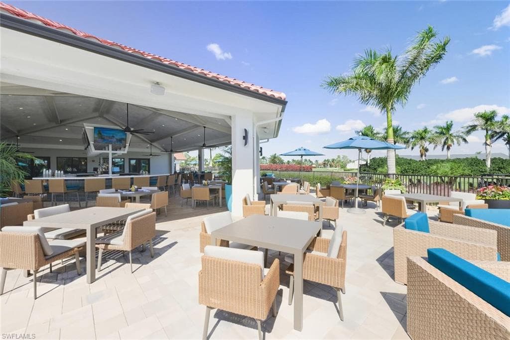 View of patio / terrace with an outdoor living / dining area and ceiling fan