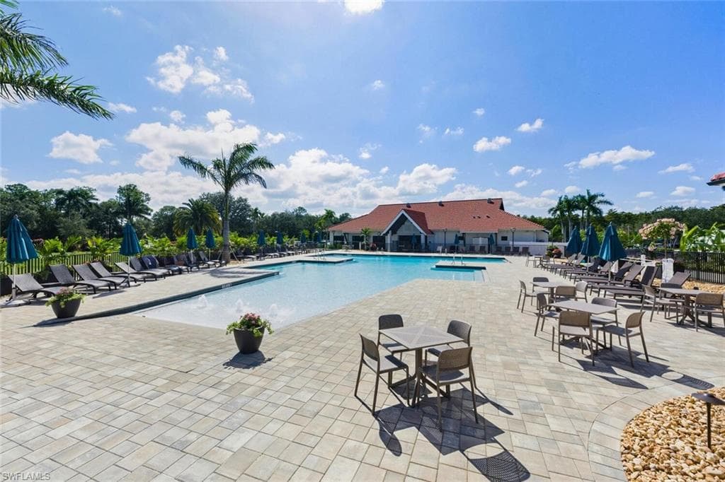 Community pool with a patio area