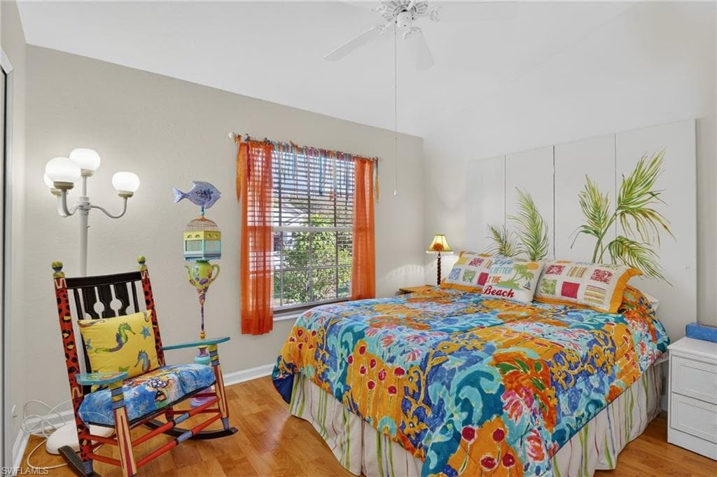 Bedroom with light wood-style flooring and a ceiling fan