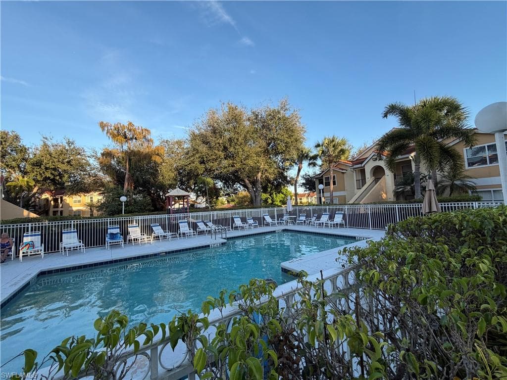 Community pool with a patio area
