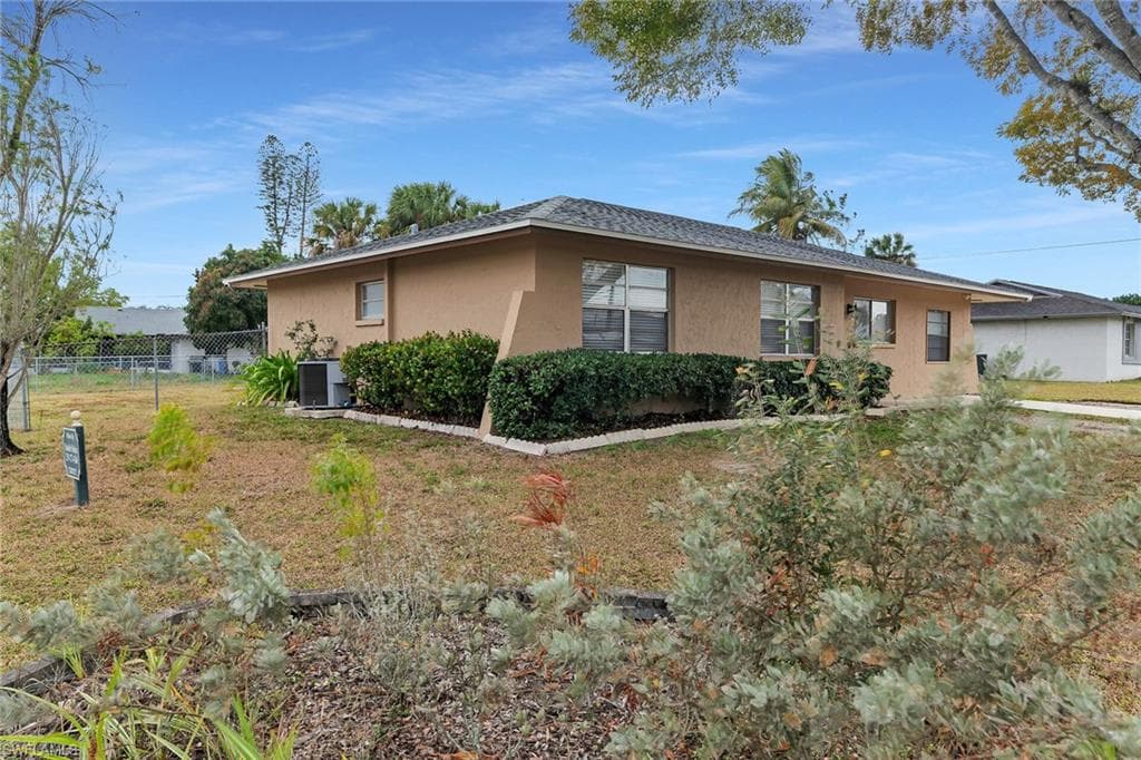 View of property exterior with stucco siding and a central air condition unit