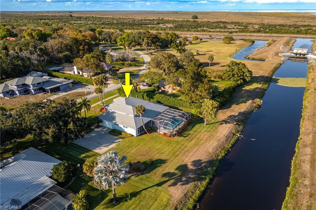 Aerial overview of property's location with a nearby body of water
