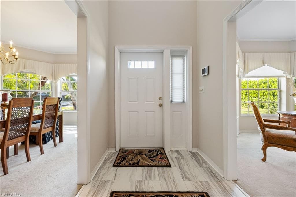 Entryway featuring a chandelier,