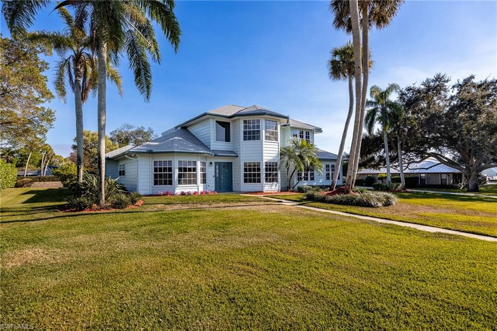 Front view of house with landscaped front yard
