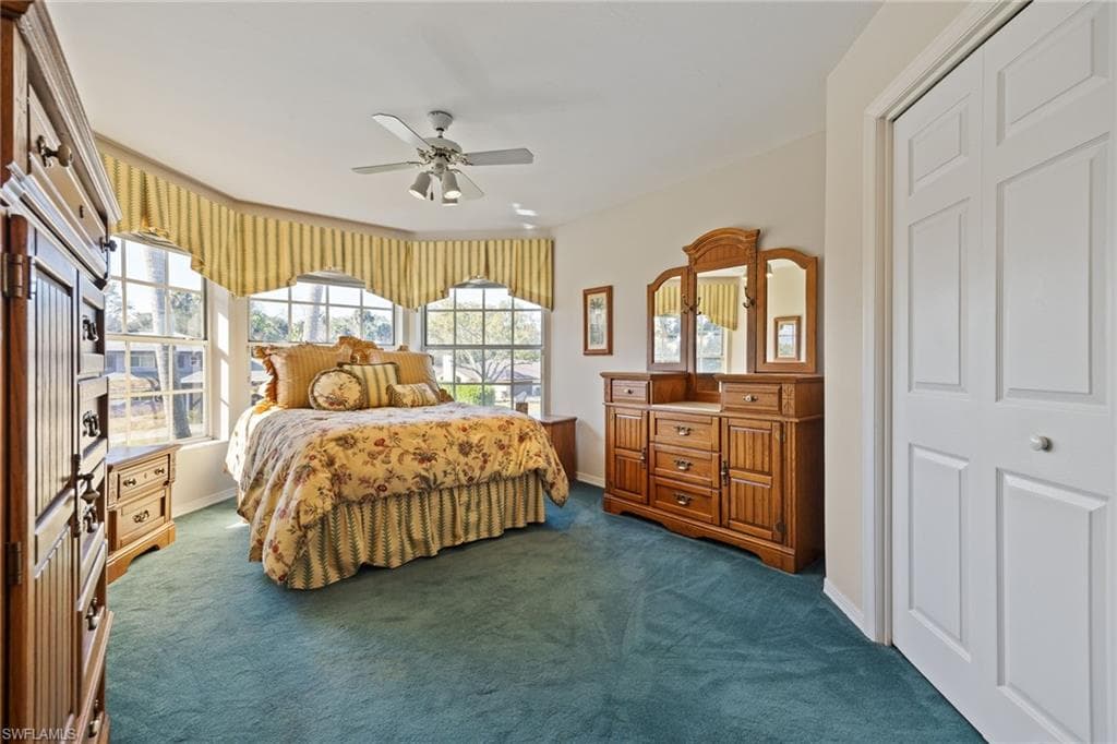 Bedroom with plenty of natural light and ceiling fan