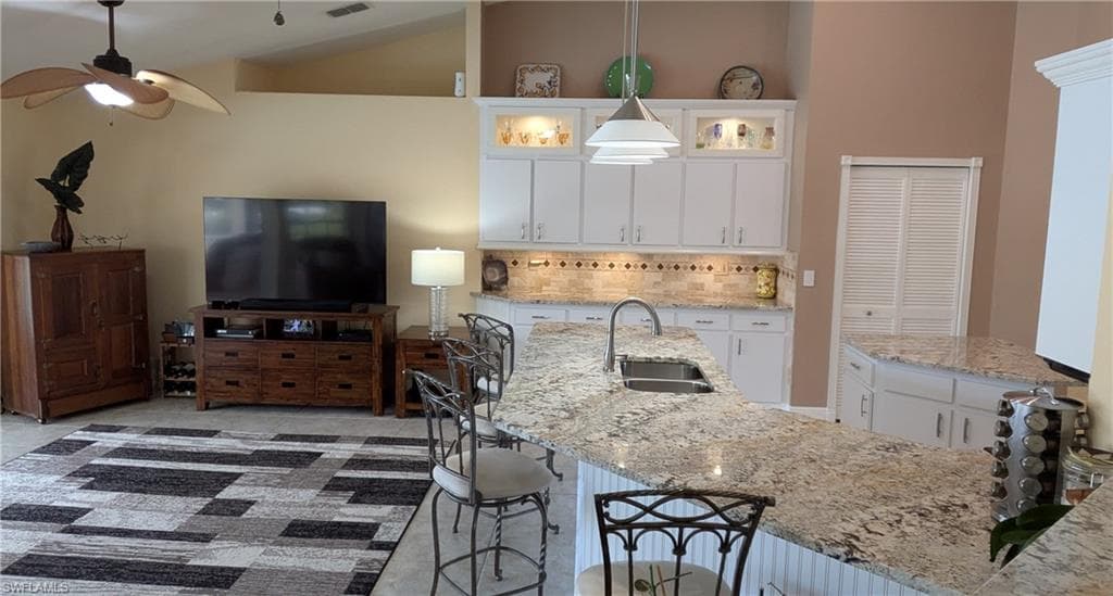 Your Family will Enjoy the Convenience of Meals Served on this Expansive Kitchen Island or in the Adjacent Dining Room
