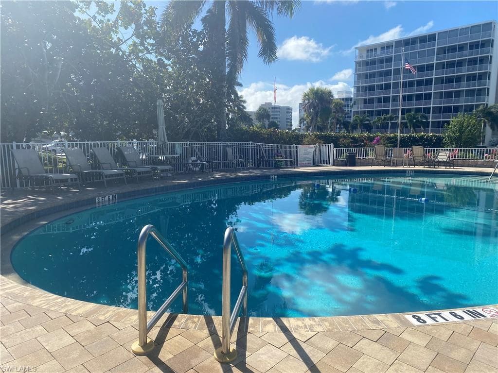 Community pool featuring a patio area