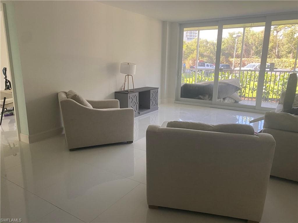 Living room featuring light tile patterned floors