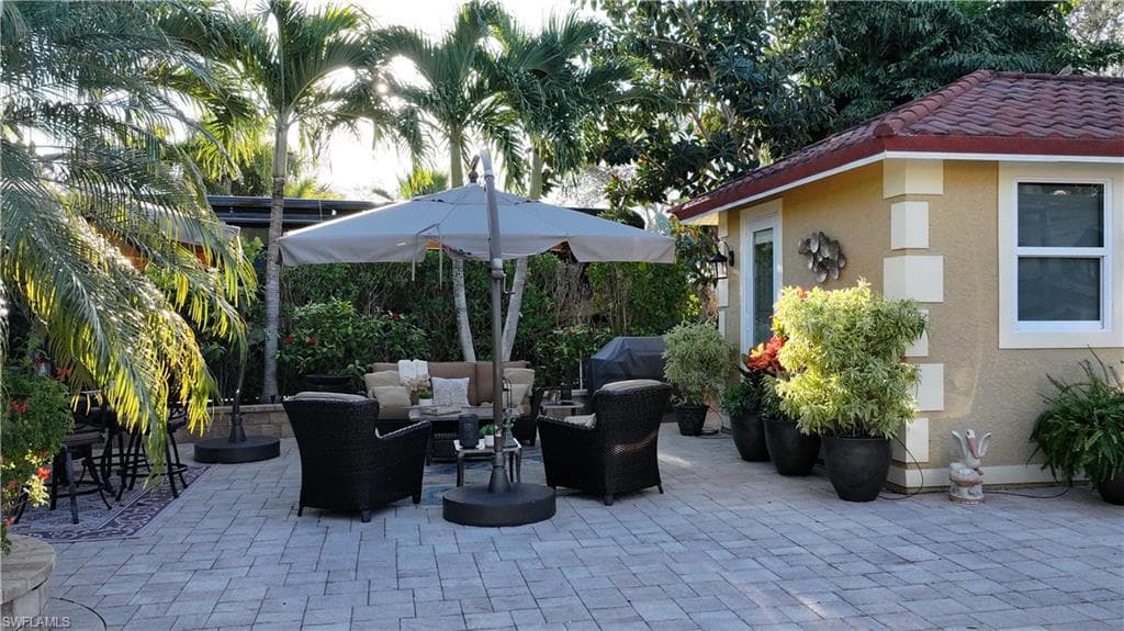 View of patio featuring outdoor lounge area and grilling area