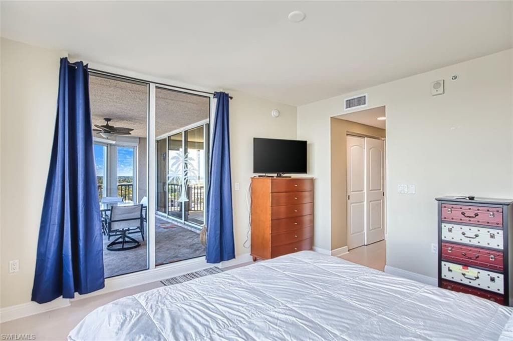 Bedroom with a closet and access to outside