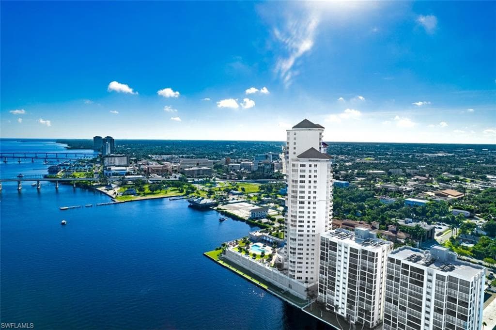 View of urban area featuring a large body of water and a notable bridge