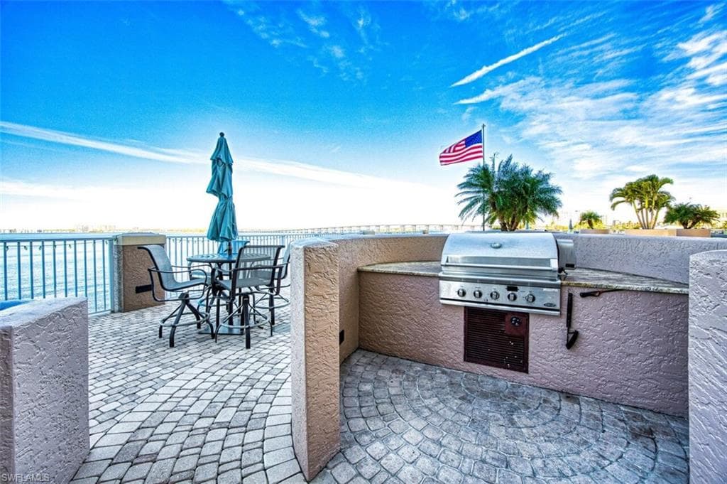 View of patio / terrace featuring grilling area and outdoor dining area