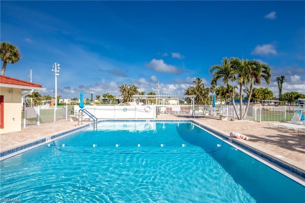 Community pool featuring a patio
