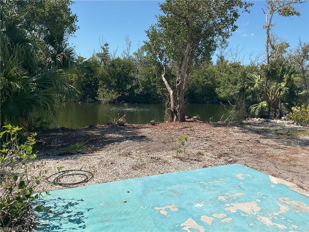 View of yard with a water view
