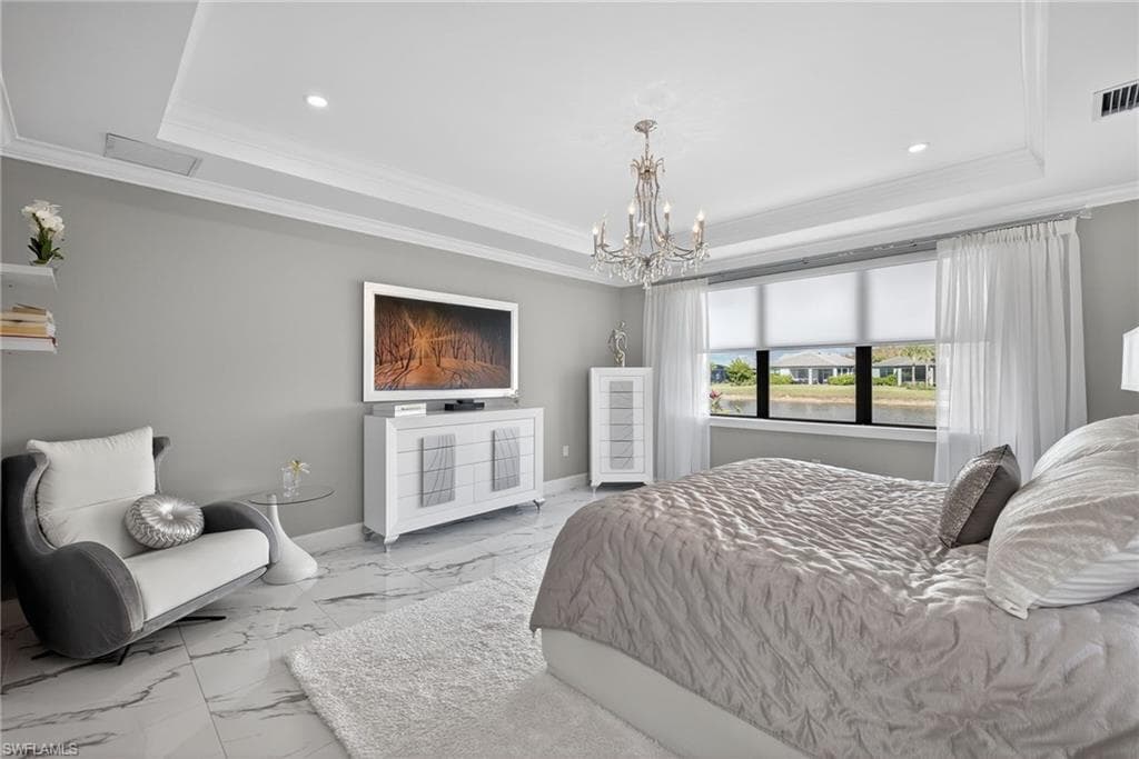 Bedroom with ornamental molding, marble look tiles, a chandelier, and recessed lighting