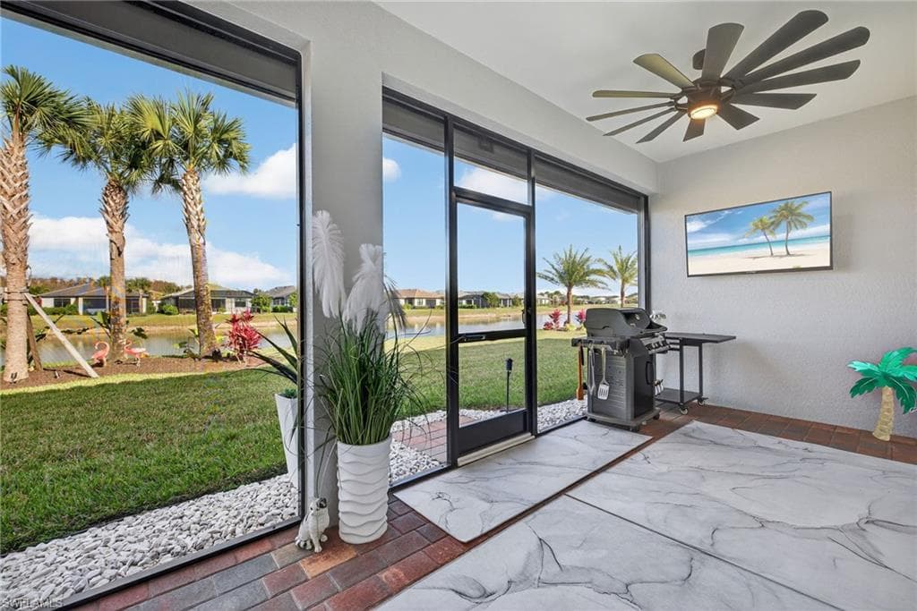 Sunroom featuring a residential view