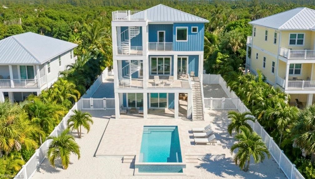 Rear 3D rendering of house with pool area, expansive decks & multiple levels - virtually enhanced