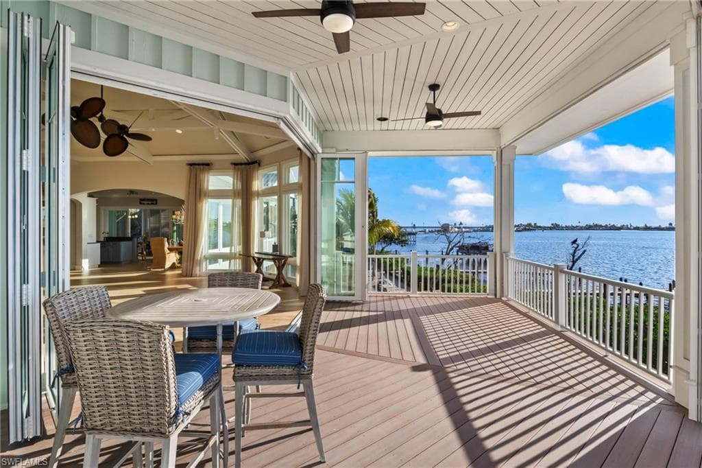 Panoramic view from the upstairs patios - custom folding hurricane impact doors retreat to allow a wide open expansion of the indoor and outdoor living spaces!
