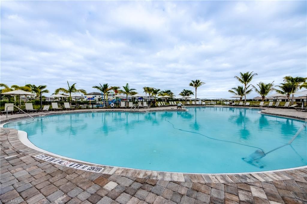 Community pool featuring a patio area
